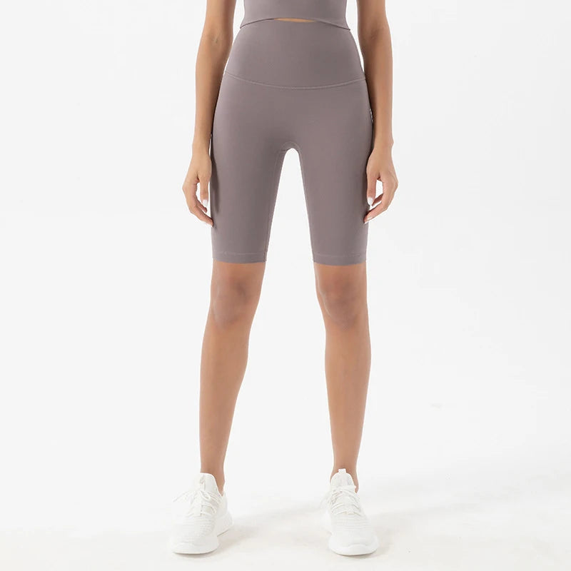 Model wearing sea rock grey women’s breathable high-waist cycling shorts, tummy control biker shorts