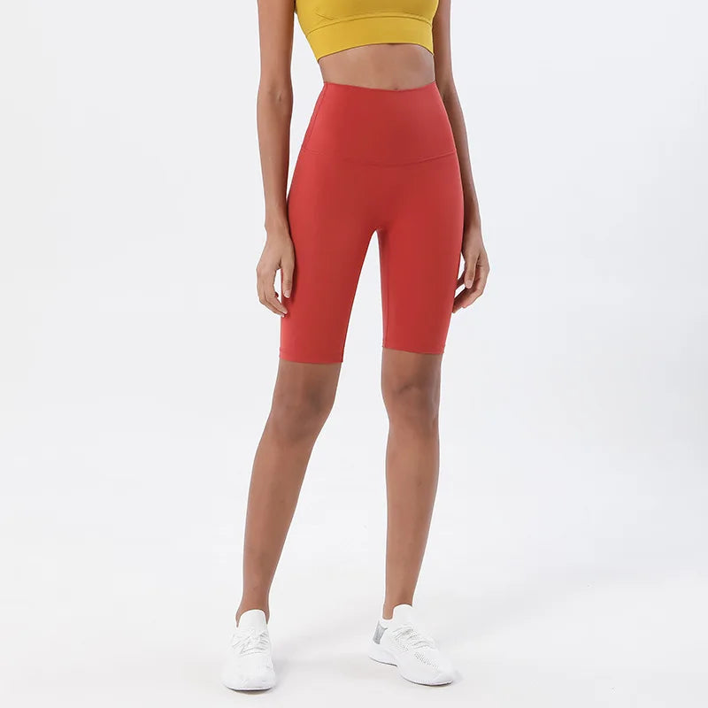 Model wearing dark red women’s breathable high-waist cycling shorts, tummy control biker shorts