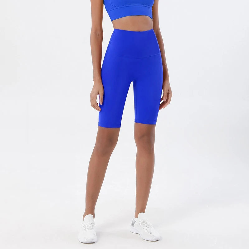 Model wearing electric blue women’s breathable high-waist cycling shorts, tummy control biker shorts