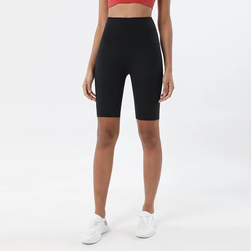 Model wearing black women’s breathable high-waist cycling shorts, tummy control biker shorts