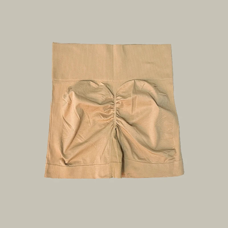 Beige shorts of women’s high-waist workout shorts and matching sports bra two-piece set