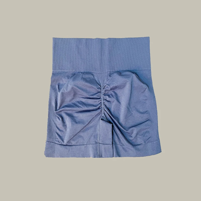 Blue shorts of women’s high-waist workout shorts and matching sports bra two-piece set