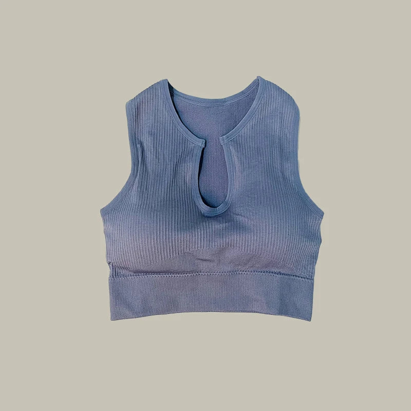 Blue top of women’s high-waist workout shorts and matching sports bra two-piece set