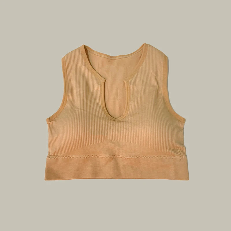 Beige top of women’s high-waist workout shorts and matching sports bra two-piece set