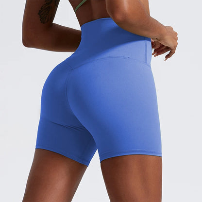 Back view of model wearing eustoma blue women’s high-waist cycling shorts – super soft tummy control biker workout shorts