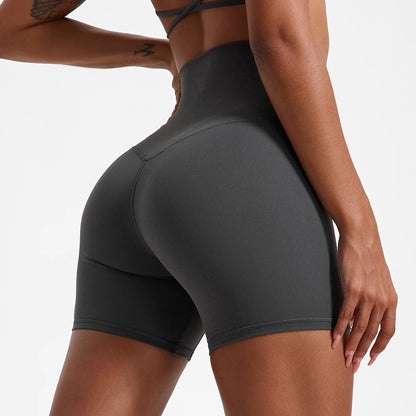 Back view of model wearing gray women’s high-waist cycling shorts – super soft tummy control biker workout shorts