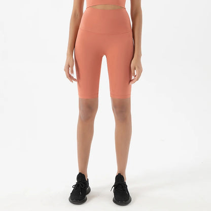 Woman modeling the front view of Coral Red Breathable Cycling Shorts for Women