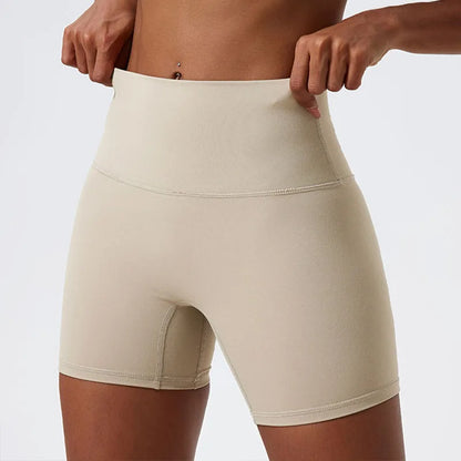 Front view of model wearing light khaki women’s high-waist cycling shorts – super soft tummy control biker workout shorts