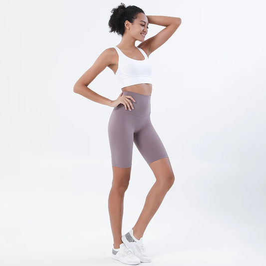 Model wearing mulberry purple women’s breathable high-waist cycling shorts – soft tummy control workout biker short