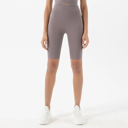 Model wearing sea rock grey women’s breathable high-waist cycling shorts, tummy control biker shorts