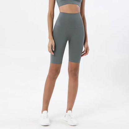 Model wearing bamboo green women’s breathable high-waist cycling shorts, tummy control biker shorts