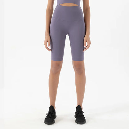 Model wearing light purple women’s breathable high-waist cycling shorts, tummy control biker shorts