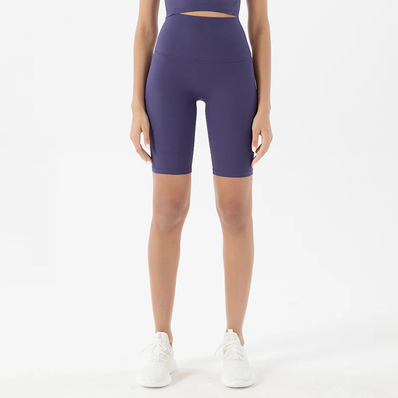 Model wearing blue purple women’s breathable high-waist cycling shorts, tummy control biker shorts