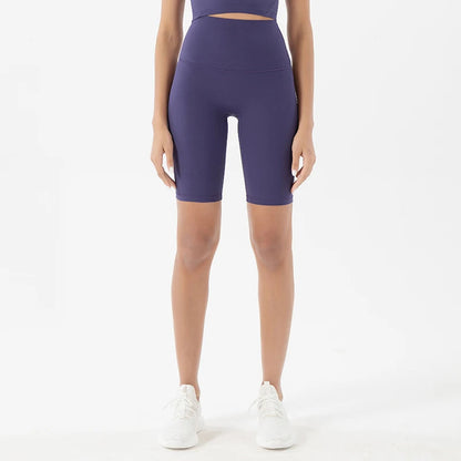 Model wearing blue purple women’s breathable high-waist cycling shorts, tummy control biker shorts