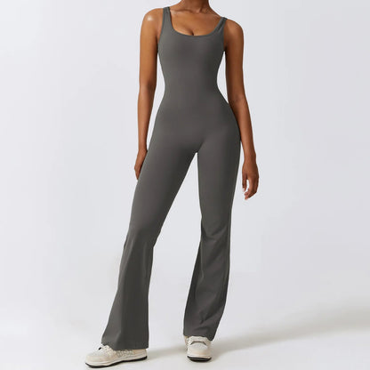 Model wearing grey women’s workout bodysuit, stretchy one-piece romper