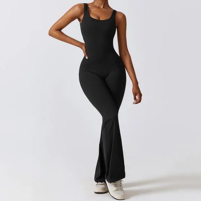 Model wearing black women’s workout bodysuit, stretchy one-piece romper
